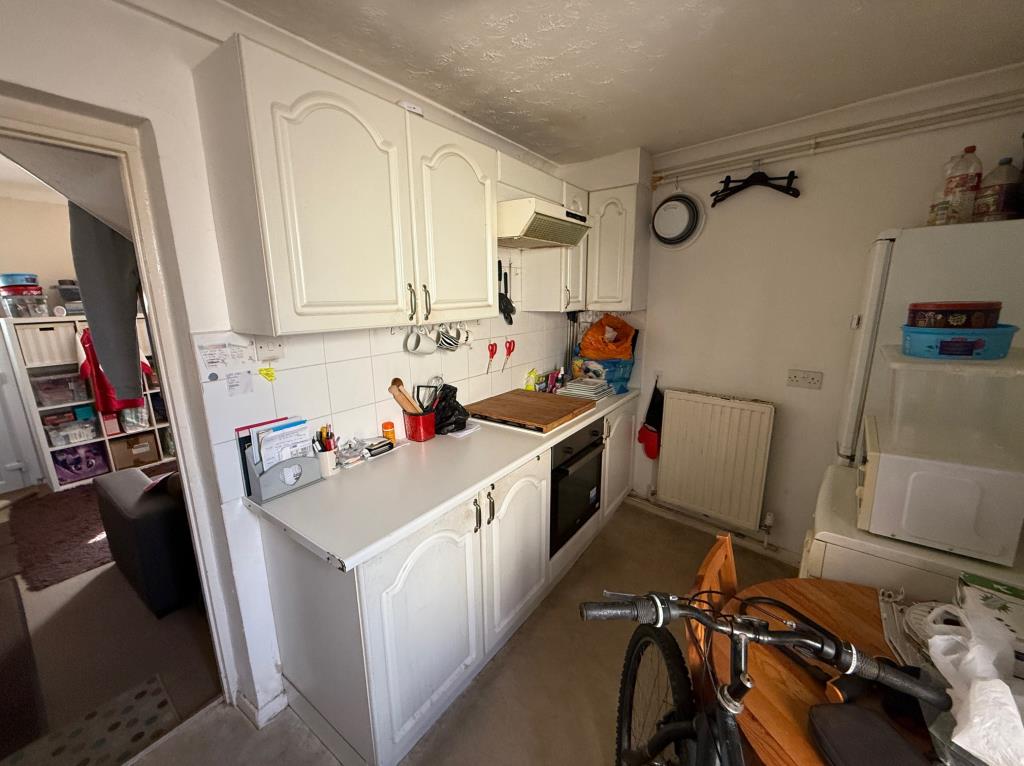 Lot: 31 - TERRACE HOUSE FOR IMPROVEMENT IN COLCHESTER CITY CENTRE - Kitchen with door to the rear